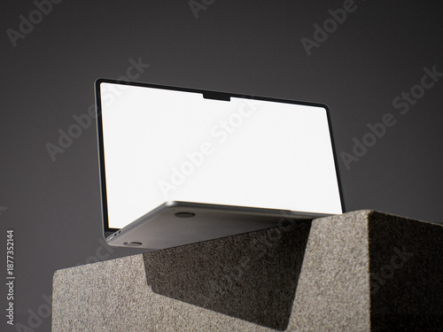 Laptop on transparent background, modern notebook computer with blank white screen placed on concrete blocks, minimal technology mockup for branding
