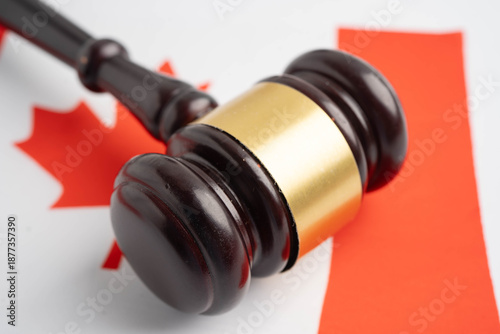 Canada law, Legal, justice and agreement, wooden court gavel on flag.