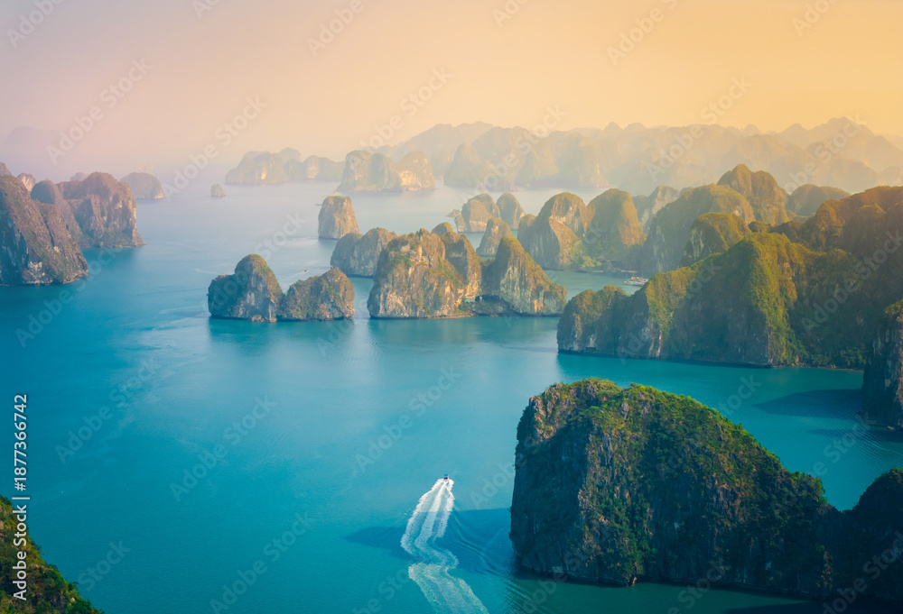 Naklejka premium Majestic landscape of Halong bay at sunrise with limestone islands, travel landmark Vietnam
