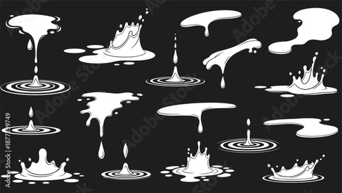 A large set of monochrome milk or white liquid splashes, drips, and puddles isolated on a black background.