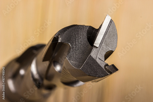 Quadro su tela diamond woodworking cutter on a wooden background in close-up
