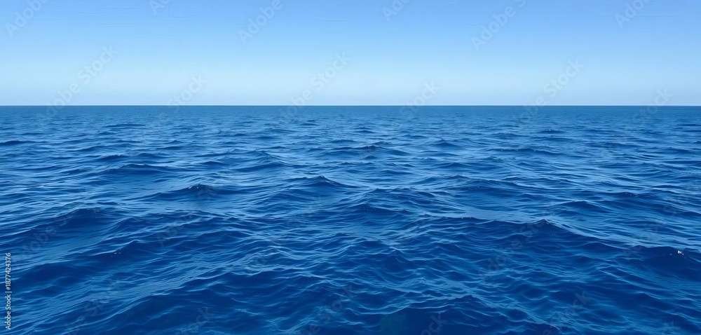 Fototapeta premium Serene deep blue ocean water surface gently rippling under a clear sky, offering a peaceful natural backdrop for design, peaceful, clear