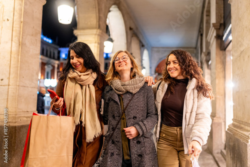 Wallpaper Mural Happy women friends enjoying winter city shopping Torontodigital.ca