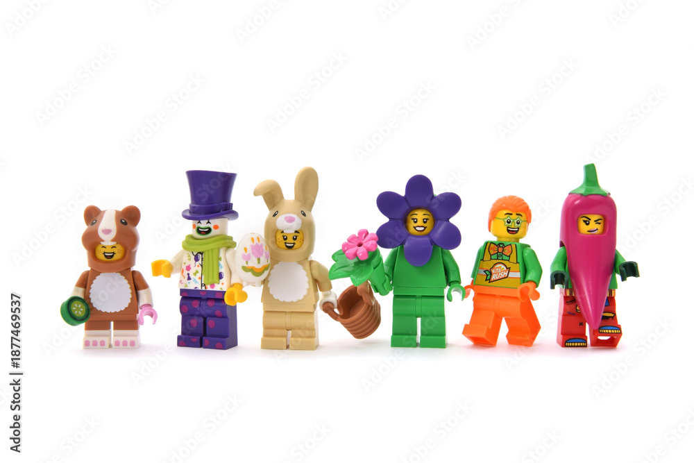 Fototapeta premium Lego minifigures of clown in purple cup and children as animals on carnival. Editorial illustrative image of holiday.