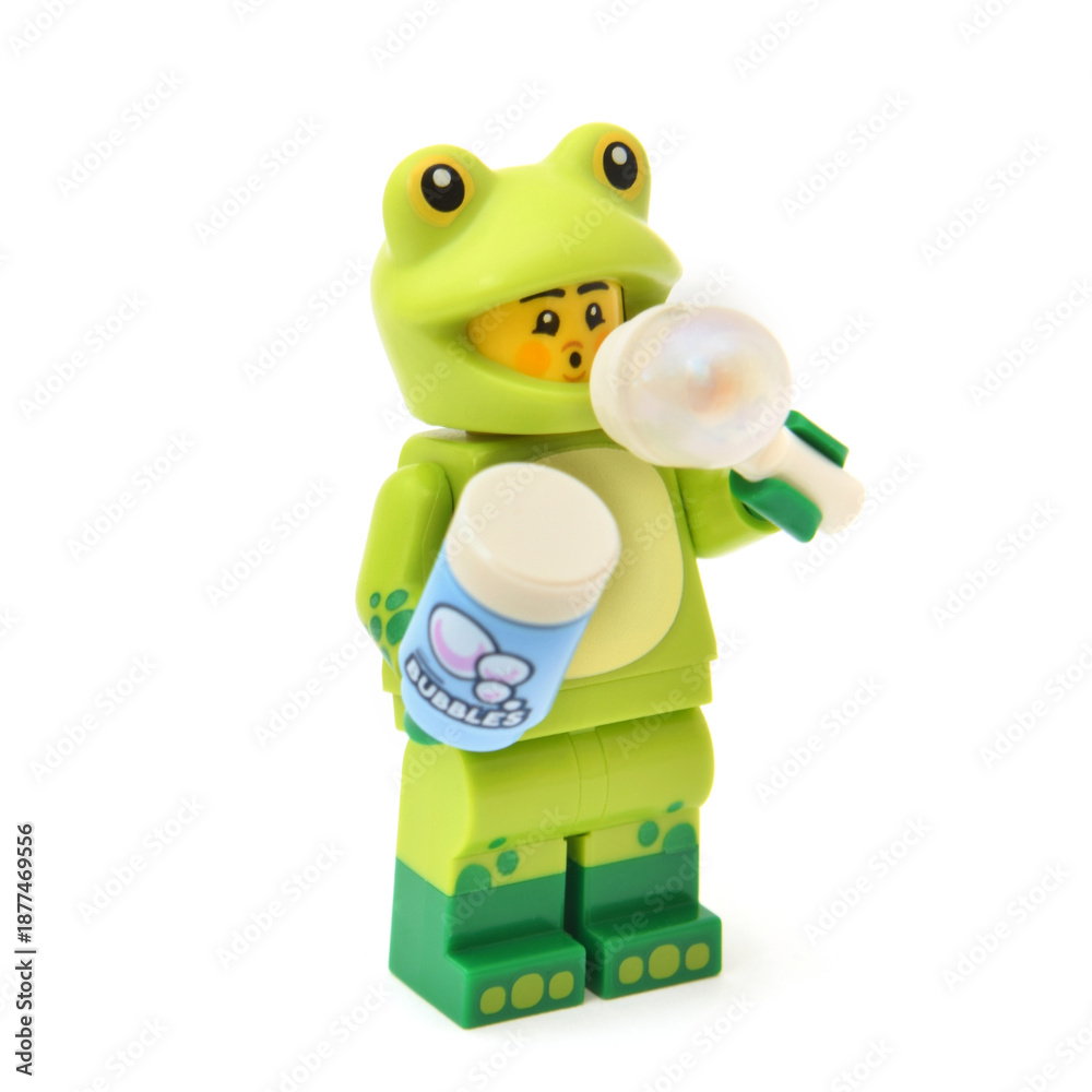 Naklejka premium Lego minifigure of frog is blowing a bubble. Editorial illustrative image of collectable dolls edition 28.