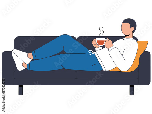 A relaxed man enjoys a cozy moment on a sofa with a cup of tea and a book. Comfortable loungewear and a warm atmosphere create a sense of peace. Perfect for lifestyle and comfort visuals.