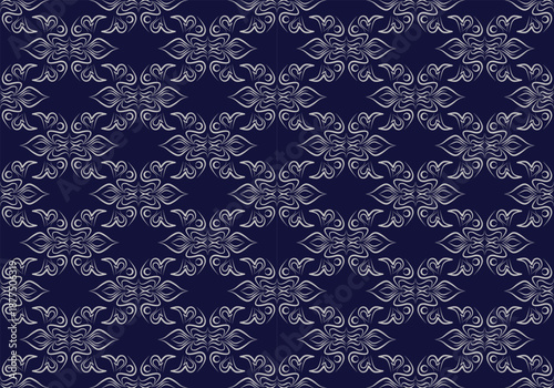 The exquisite seamless pattern is distinguished by silver embellishments on a dark blue background.