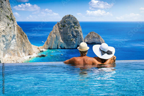 Photography A couple swimming in an infinity pool and enjoying the view of the famous Mizith