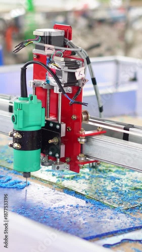 A CNC machine operating in an industrial workshop, performing precise automated cutting and manufacturing processes.