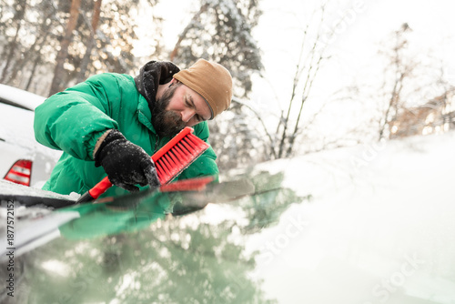 Man Clearing Under Wipers and Checking for Complete Clean