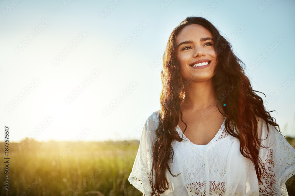 Fototapeta premium Thinking, woman and smile for travel outdoor with reflection, fresh air and daydreaming on holiday. Space, female person and vacation with vision in field, sightseeing and happy memory in countryside
