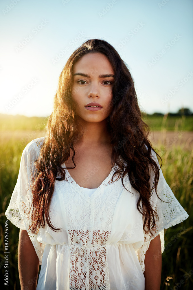 Fototapeta premium Portrait, woman and travel with field outdoor for summer adventure, explore nature or holiday. Confident, female person and space in meadow for peace, calm morning and vacation getaway in countryside
