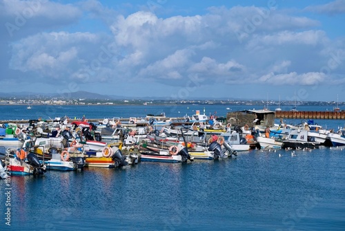 Fishing boats off the island of Culatra. It protects the Ria Formosa lagoon landscape between the islands and the mainland. Algarve, Portugal