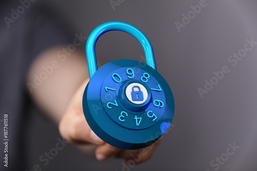 Hand holding a blue lock, c...