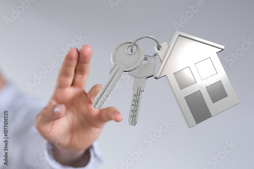 Person reaching for a house...