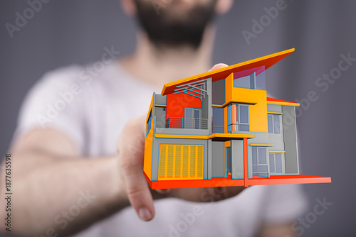 A person's hand holding a 3...