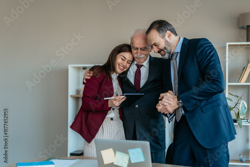 Obraz na płótnie Senior Businessman with Son and Daughter in Modern Office – Family Business Tran