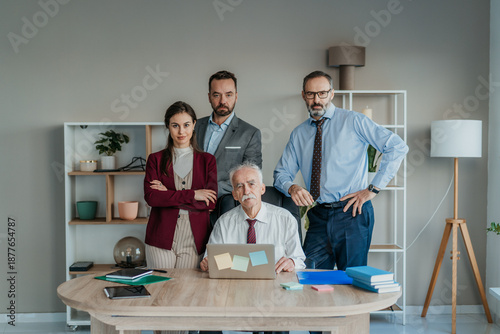 Multi-Generational Family Business Team Portrait in Modern Office – Serious Expression Family Firm