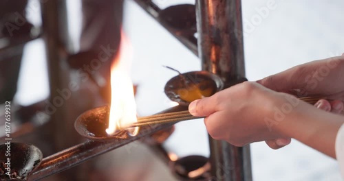 Pilgrims Lighting Oil Lamps During Prayer at the Temple of the Sacred Tooth Relic (Sri Dalada Maligawa), Kandy, Sri Lanka