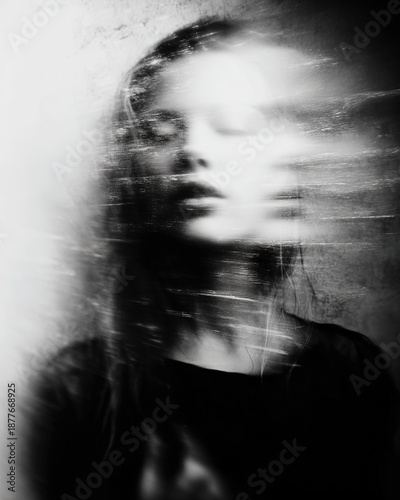 Ghostly young woman experiencing internal psychological turmoil and motion blur