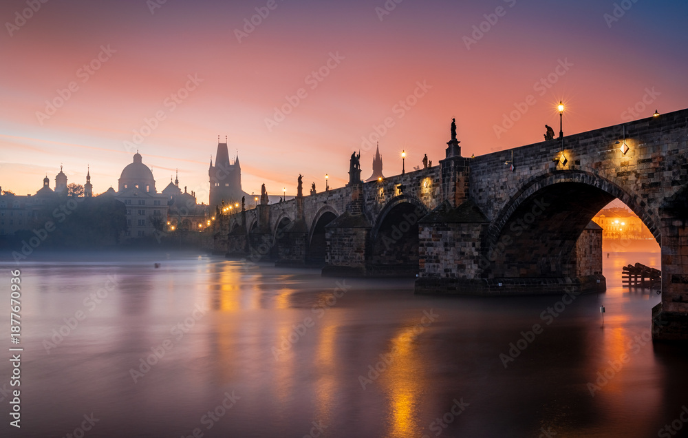 Fototapeta premium city prague river bridge europe night castle architecture sunset church water town travel tower stockholm reflection building czech old panorama winter skyline cathedral sky light fog, dawn, autumn