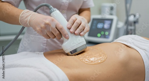 Woman receiving ultrasonic cavitation treatment on her abdomen. Practitioner performing body sculpting procedure with modern cosmetology device. Weight loss concept.