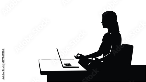 Silhouette of a woman meditating at a desk with a laptop, finding peace in work.