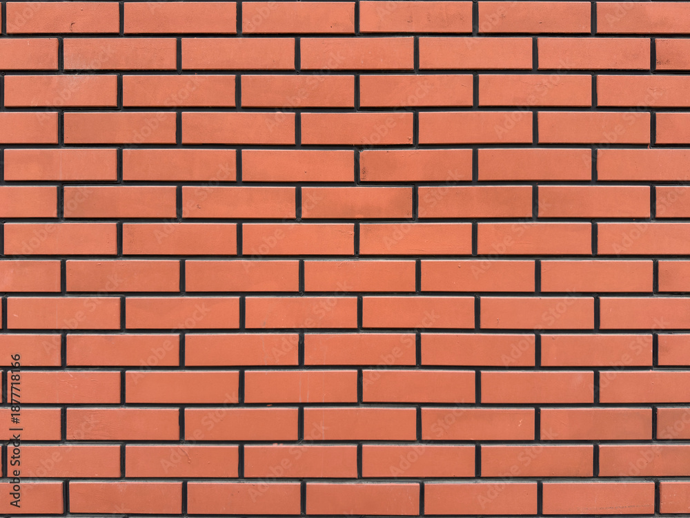 Fototapeta premium Red brick wall background texture pattern for architectural design. Construction material surface concept for building and renovation banner.