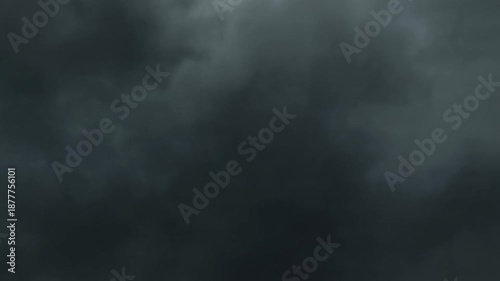 Dramatic and foreboding dark storm clouds gathering in the sky, signaling impending severe weather and a powerful atmospheric event. A cloudy and gloomy day with a sense of tension and natural drama