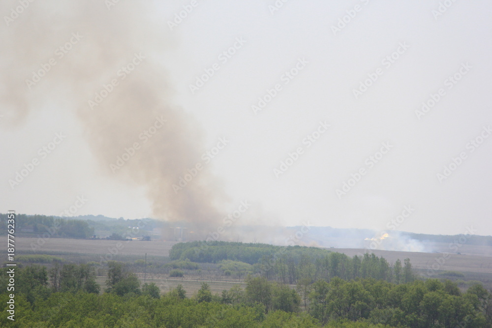Fototapeta premium Hemp bale fire in the valley.