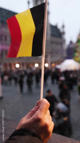 Young Woman With Belgian Flag In Grand Place Brussels With Tourists At New Year Holidays With Decorated Tree, Vertical Video