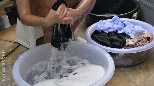 Woman washing clothes by hands. Washing by hand is therefore a great way to keep them looking new and fresh for longer.