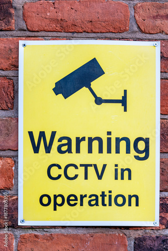 cctv warning sign on the wall