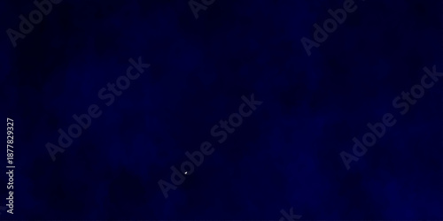 Abstract blue powder explosion cloud on dark background. Deep blue textured abstract background. Dark blue leather texture background. old blue background.
