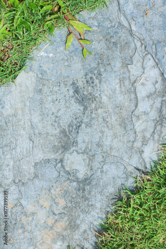 Close-up view of granite laid on grass lawn, creating a natural
