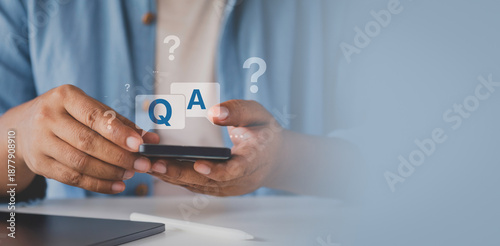 Tableau sur toile International ask a question day concept, Businessman hand clicking Q&A or Quest