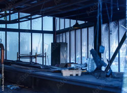 Photos Burnt interior of restaurant with damaged equipment and debris