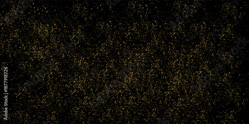 Gold glitter texture on a black background. Holiday background. Golden explosion of confetti. modern