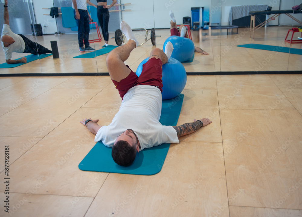 Fototapeta premium Physical rehabilitation exercises for legs in the gymnasium