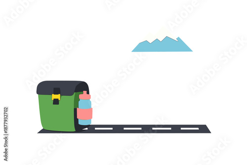 Backpack and water bottle on road with mountain in background