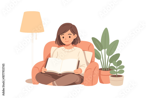 Woman reading a book in a cozy armchair by lamplight