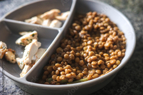 Close-up of cooked lentils and chicken for baby food