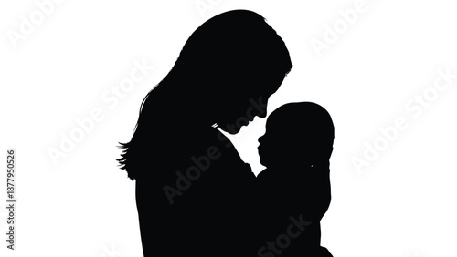 Silhouette portrait captures the tender loving moment between a mother and her infant child