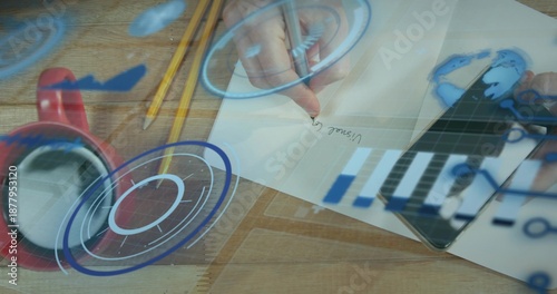 Writing adult hands holding pen tapping tablet at desk light shirt cuff paper pencils mug HUD