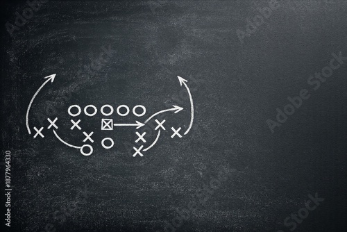 Chalkboard displays football play strategy with Xs and Os arranged for Super Bowl game preparation and planning