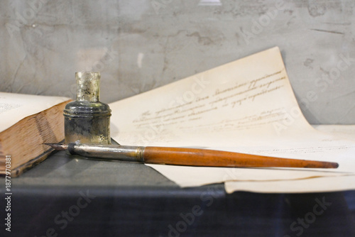 Open old diary or notebook with classic pen.