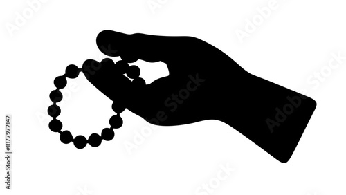 A silhouette of a hand holding a string of prayer beads, counting them one by one.