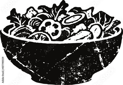 Fresh vegetable salad bowl with leafy greens, tomato slices, and cucumber pieces