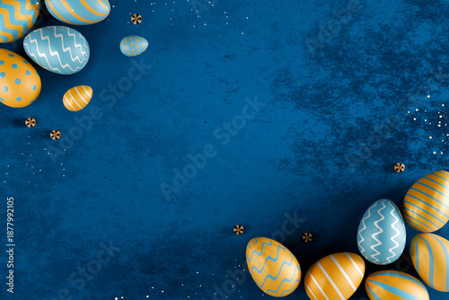 Colorful easter eggs with blue and yellow patterns on a blue textured background. 3d rendering