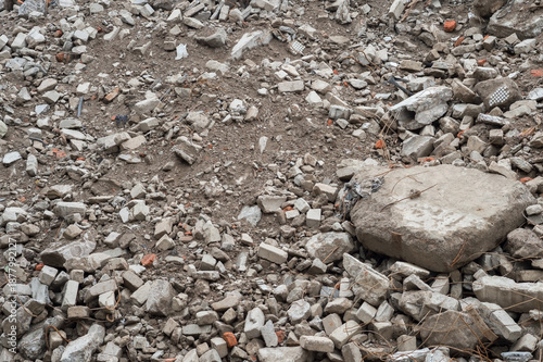 Pile of broken concrete rubble and scattered debris with exposed wires and dirt, destruction and decay concept, Copy space